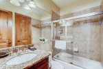 Spacious bathroom with shower/ bath combination